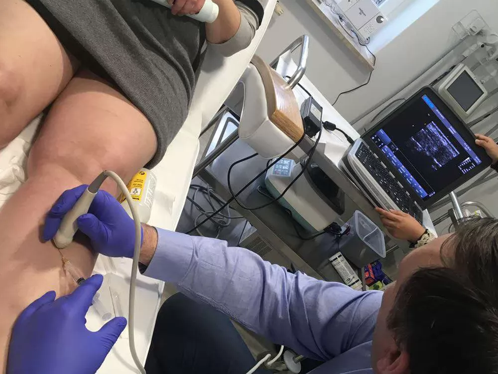 Economical portable sonographer with light weight, acceptable image quality, with color flat screen display, limited features and hardware capabilities